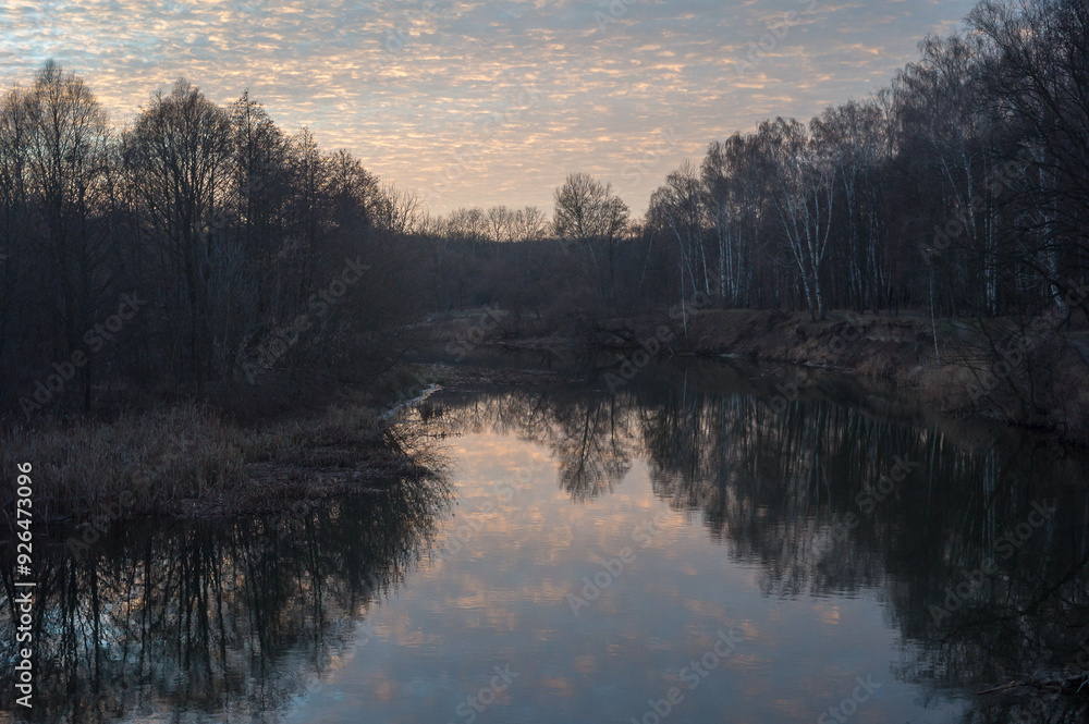 Fototapeta premium Bright sky, river and trees at sunset, natural background.