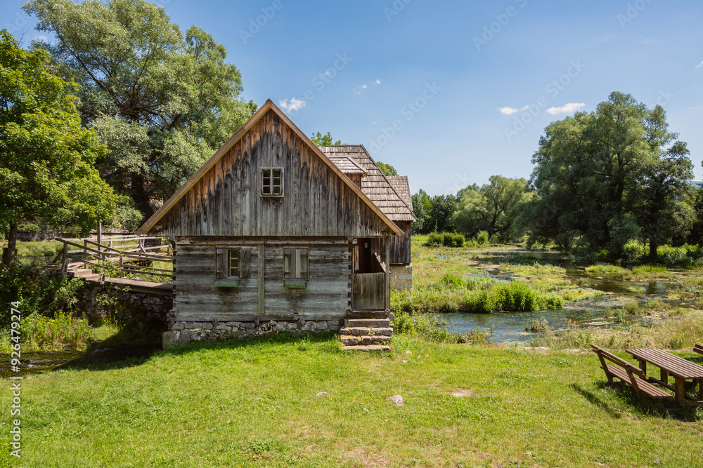 Majerovo Vrilo, beautiful wooden mill houses on the spring of Gacka river, Croatia, one of the last mills preserved in this mountain region Majerovo Vrilo, beautiful wooden mill houses on the spring of Gacka river, Croatia, one of the last mills preserved in this mountain region