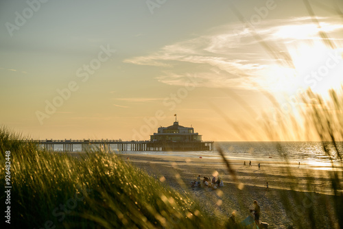 Sunset over the pier at the beach in Blankenberge, Belgium  photo