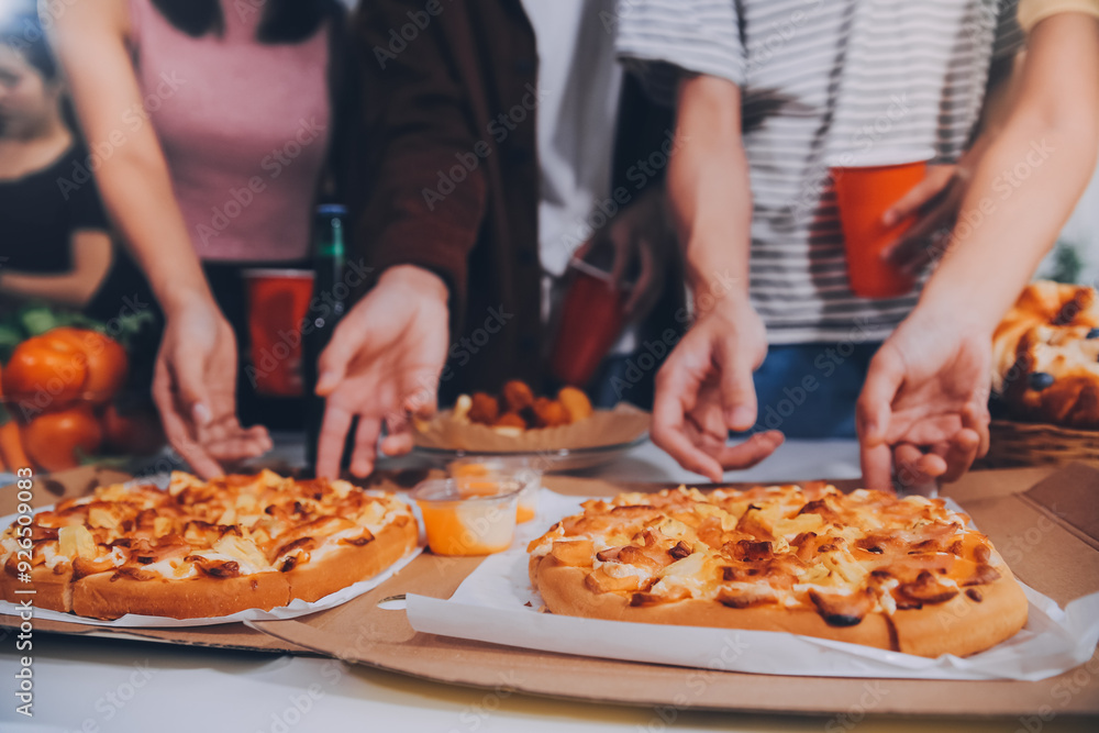 Group of young friends eating pizza.Home party. Group of young friends eating pizza.Home party.