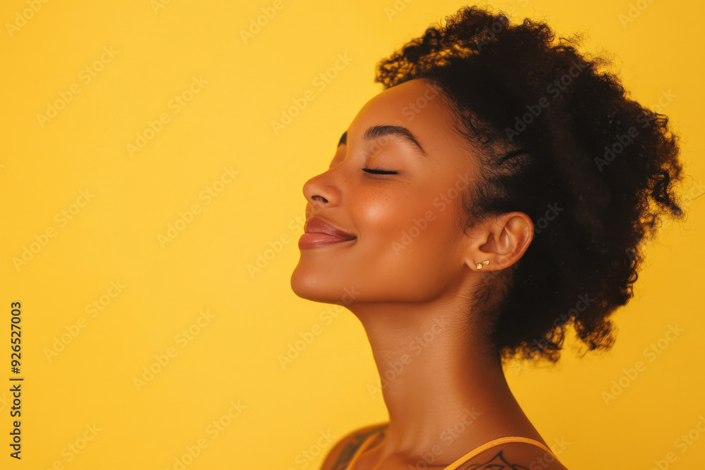 A close up of a tattooed black woman's face with her eyes closed A close up of a tattooed black woman's face with her eyes closed
