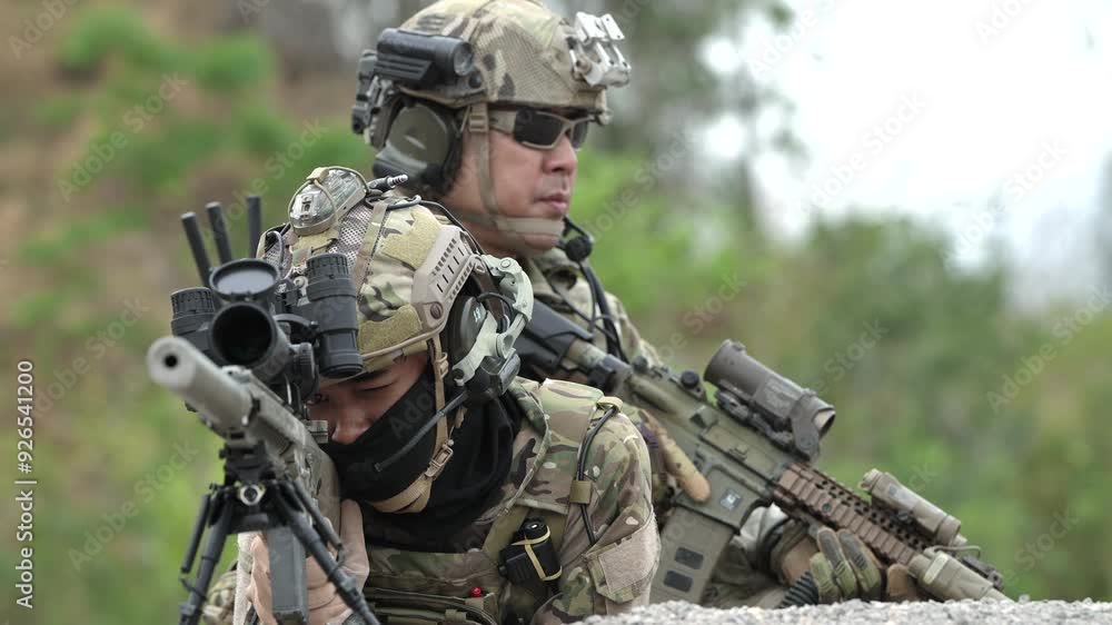 Soldiers in full gear and equipment move quickly into a combat zone with the enemy. In a military zone before military training or combat. Modern military gear and equipment in a new combat style. Soldiers in full gear and equipment move quickly into a combat zone with the enemy. In a military zone before military training or combat. Modern military gear and equipment in a new combat style.