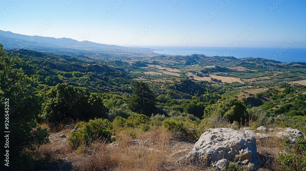Scenic overlook from Filerimos Hill, gazing southwest towards the expansive coastline and rolling hills below. Scenic overlook from Filerimos Hill, gazing southwest towards the expansive coastline and rolling hills below.