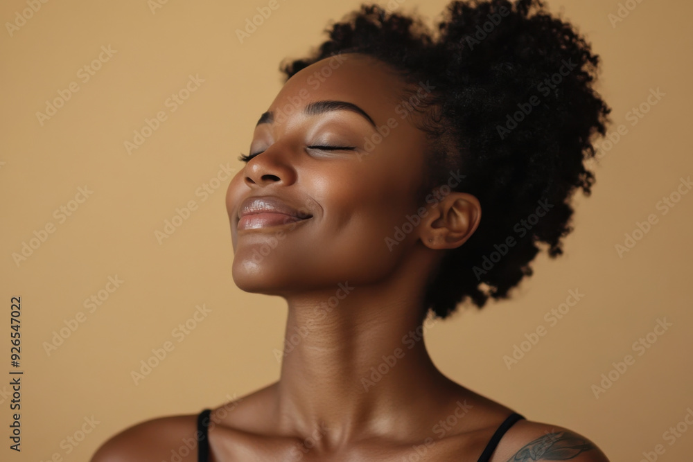 A close up of a tattooed black woman's face with her eyes closed A close up of a tattooed black woman's face with her eyes closed