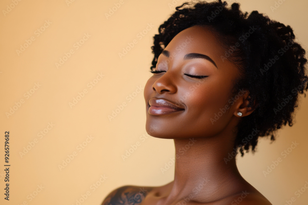 A close up of a tattooed black woman's face with her eyes closed