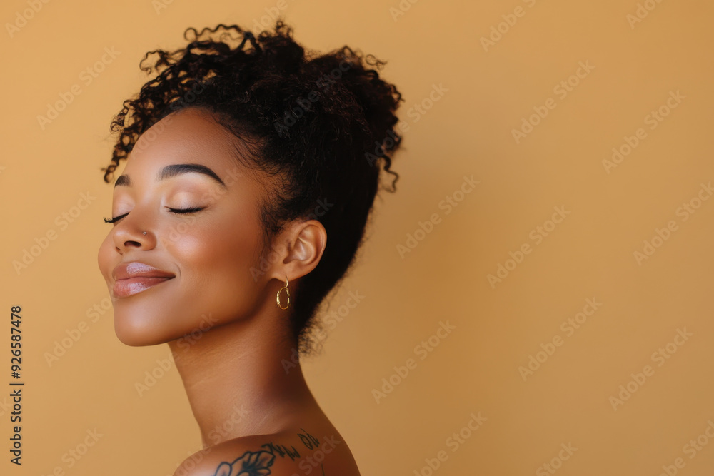 A close up of a tattooed black woman's face with her eyes closed