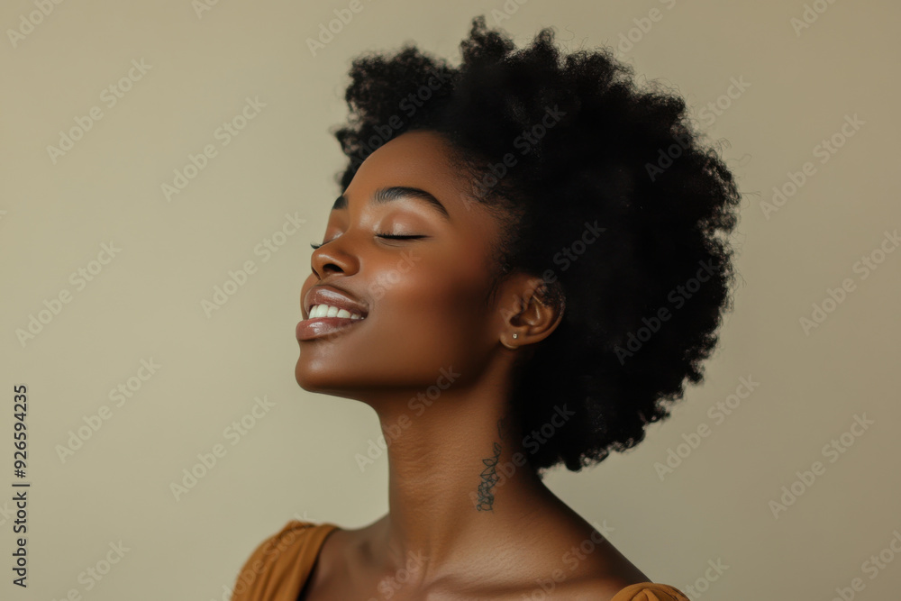A close up of a tattooed black woman's face with her eyes closed A close up of a tattooed black woman's face with her eyes closed