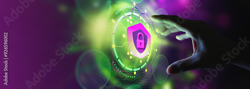 Obraz na płótnie A hand reaches out towards a glowing digital lock icon, symbolizing cybersecurity and data protection. The image features vibrant neon colors, including green and purple, with a futuristic interface b w salonie