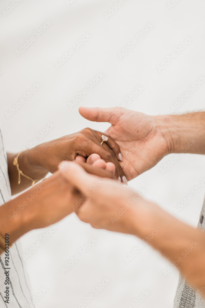 Woman and man holding hands after proposal Woman and man holding hands after proposal