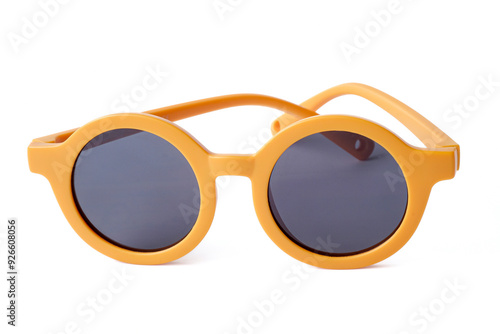 Yellow kids sunglasses close up on white background.