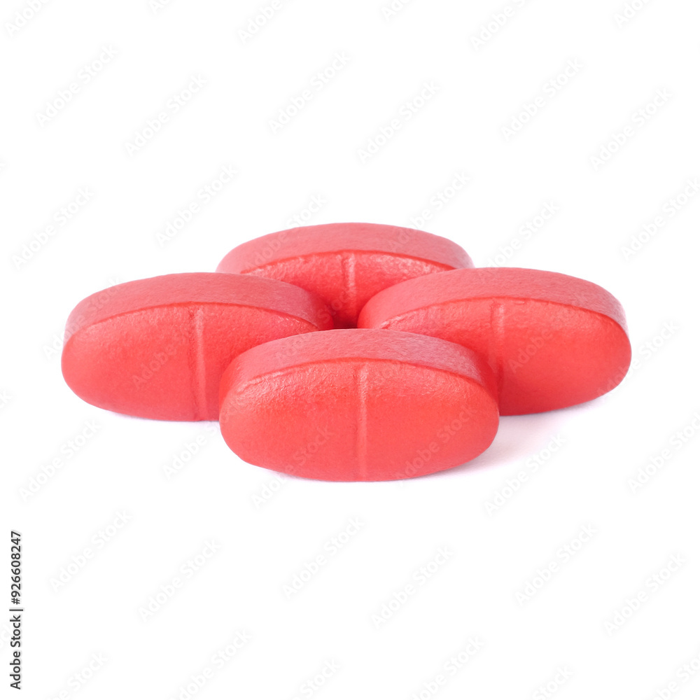 Red oral medication tablets close up on white background.