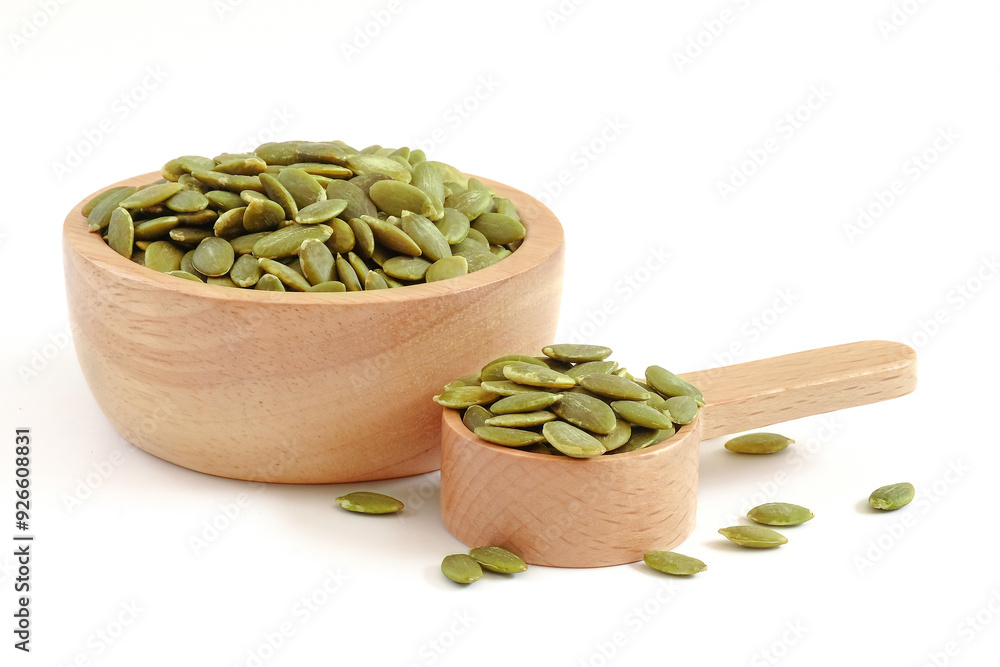 Pumpkin seeds close up on white background.