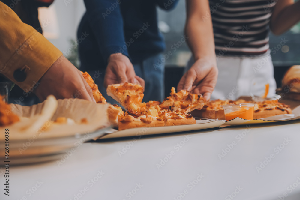 Group of young friends eating pizza.Home party. Group of young friends eating pizza.Home party.