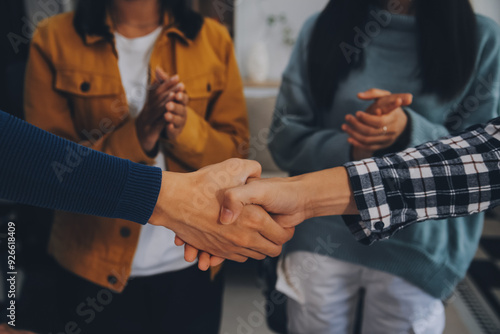 portrait of Business people shaking hands, finishing up a meeting