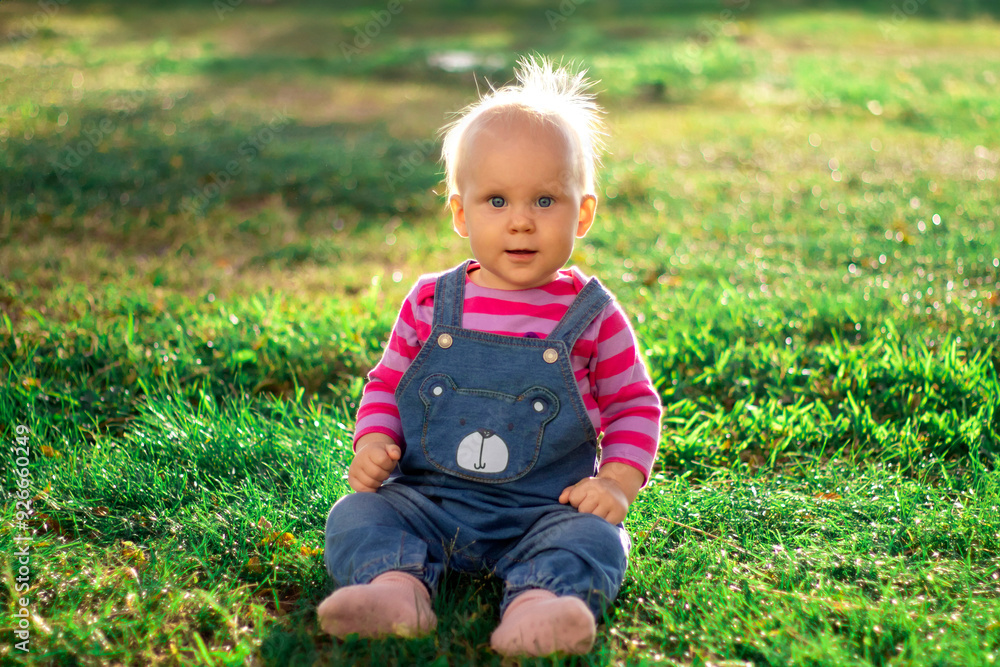 A Cute Baby Delightfully Having Fun While Enjoying Nature and Playing in the Warm Sunshine A Cute Baby Delightfully Having Fun While Enjoying Nature and Playing in the Warm Sunshine