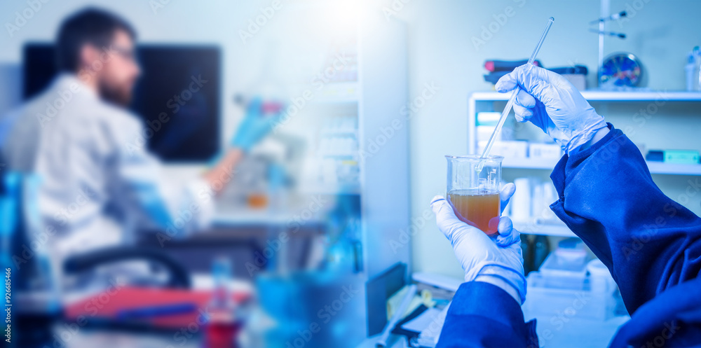 Industrial expertise analysis of oil in laboratory test tube with fuel in hands of scientist. Synthesis of new type of fuel. Expertise in industrial laboratory. Petroleum quality testing Industrial expertise analysis of oil in laboratory test tube with fuel in hands of scientist. Synthesis of new type of fuel. Expertise in industrial laboratory. Petroleum quality testing