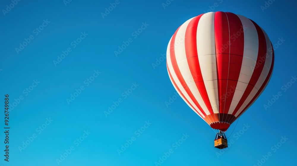 Obraz premium A red and white hot air balloon flying in the sky, AI