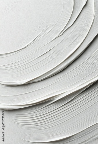 Layers of textured white paint on canvas creating a smooth artistic surface