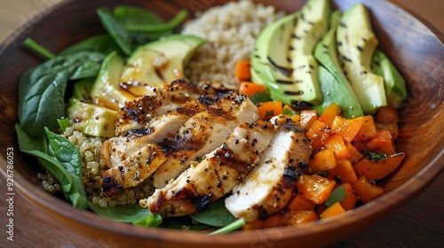 Healthy buddha bowl lunch with grilled chicken quinoa spinach avocado