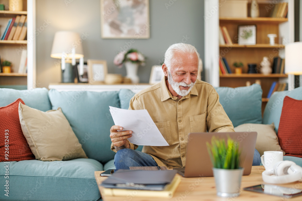 Senior Businessman Working from Home on Laptop Senior Businessman Working from Home on Laptop