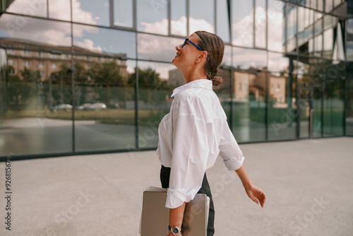 A Confident Businesswoman is Walking with Purpose in a Modern Urban Setting Today