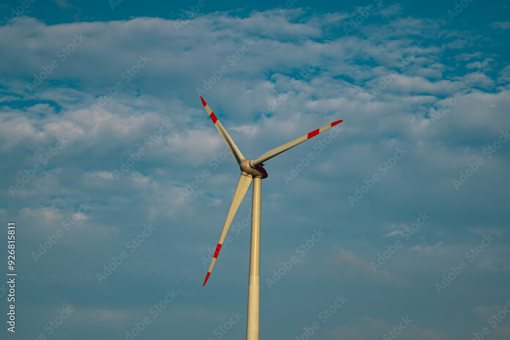 Windmills turbines generating electricity. Green energy. Turbine farm. Renewable energy source. Windmills turbines generating electricity. Green energy. Turbine farm. Renewable energy source.