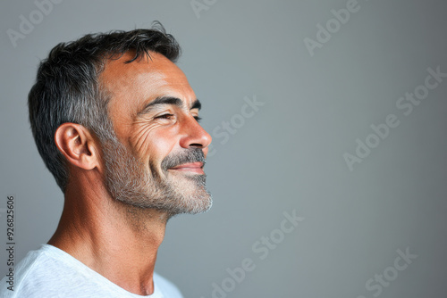 A close up of a man's face with her eyes closed