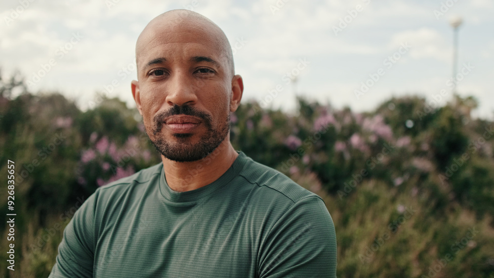Portrait of calm mindful athletic man outdoors in summer, blured background Portrait of calm mindful athletic man outdoors in summer, blured background
