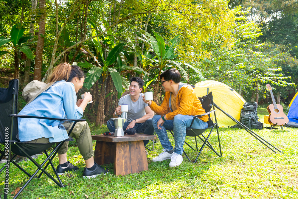 Group of Asian Man and woman friends having breakfast and making brewed coffee at camp in the morning. People enjoy and fun outdoor lifestyle travel nature and camping together on summer vacation. Group of Asian Man and woman friends having breakfast and making brewed coffee at camp in the morning. People enjoy and fun outdoor lifestyle travel nature and camping together on summer vacation.
