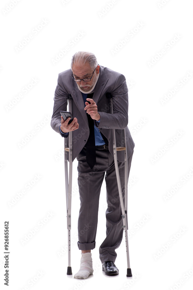 Old businessman after car accident isolated on white Old businessman after car accident isolated on white