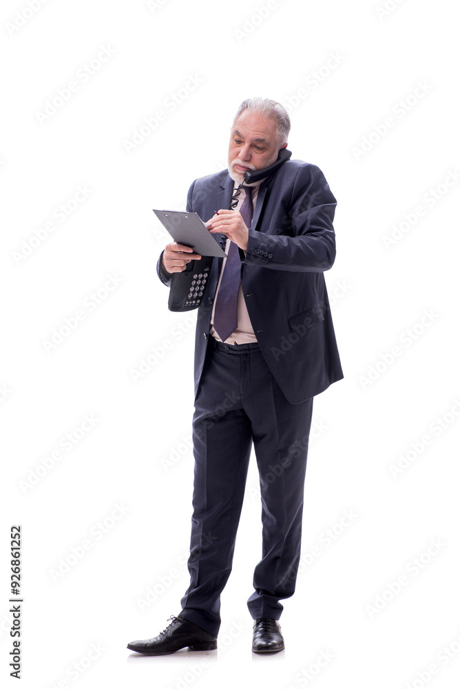 Old businessman talking by phone isolated on white Old businessman talking by phone isolated on white