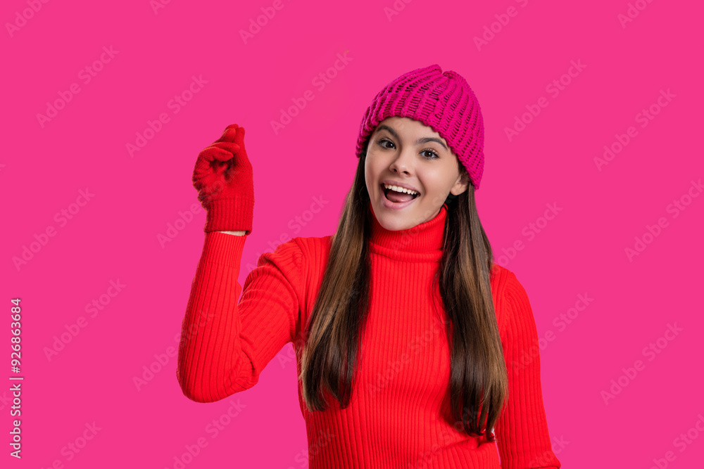 Fall style and teen girl. Stylish girl hold something invisible. Fall season. Hello autumn. Smiling teen girl in hat and gloves isolated on pink. Holding invisible. Autumn and adolescence Fall style and teen girl. Stylish girl hold something invisible. Fall season. Hello autumn. Smiling teen girl in hat and gloves isolated on pink. Holding invisible. Autumn and adolescence