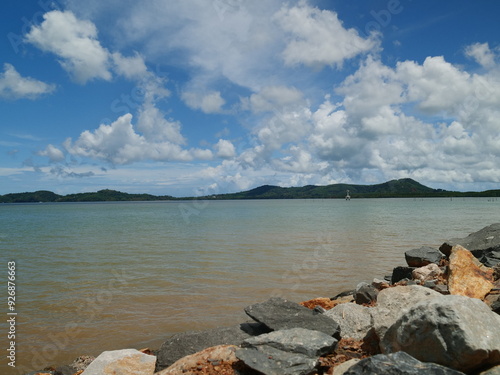 Turquoise ocean sea water white wave splashing deep blue sea. Bird eye view monster wave splash on rock. Tropical sea beach in summer seaside outdoor. Ocean island beautiful dramatic landscape.