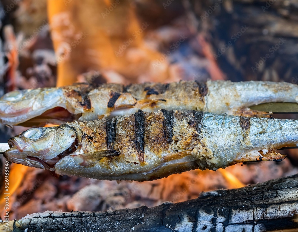 fish being grilled on burning firewood. generative ai fish being grilled on burning firewood. generative ai