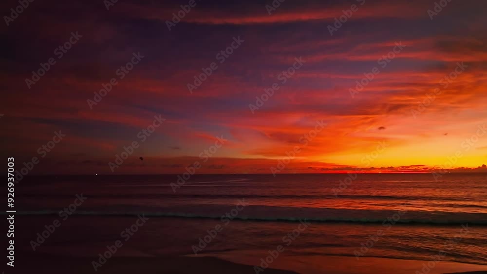A captivating scene of a vibrant sunset casting an orange and purple glow across the sky, with gentle ocean waves lapping at the shoreline. The dramatic cloud formations add depth to the serene A captivating scene of a vibrant sunset casting an orange and purple glow across the sky, with gentle ocean waves lapping at the shoreline. The dramatic cloud formations add depth to the serene