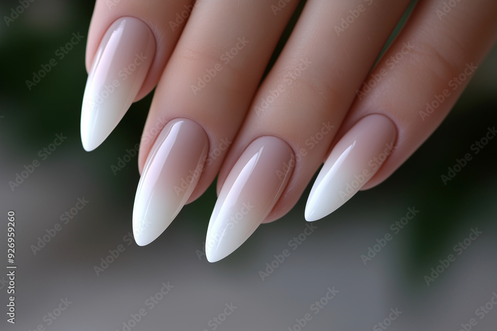 woman's hand with a manicured set of white and pink nails. The nails are painted in a gradient of white and pink, with the pink being more prominent on the tips. Scene is elegant and sophisticated woman's hand with a manicured set of white and pink nails. The nails are painted in a gradient of white and pink, with the pink being more prominent on the tips. Scene is elegant and sophisticated