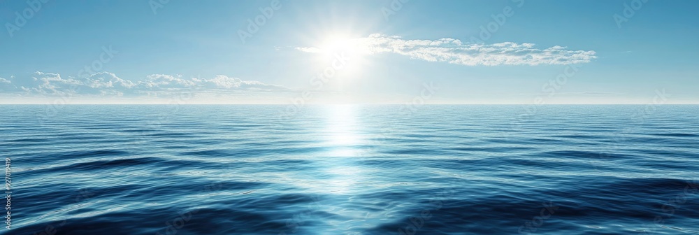 Fototapeta premium A beautiful view of sea, blue sky wave and sun shine on the water surface making the atmosphere calm and peacful.
