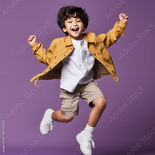 side view asian kids boy jumping and hand up, in the style of advertising photoshoot