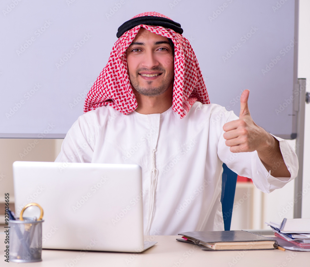 Arab teacher in front of whiteboard Arab teacher in front of whiteboard