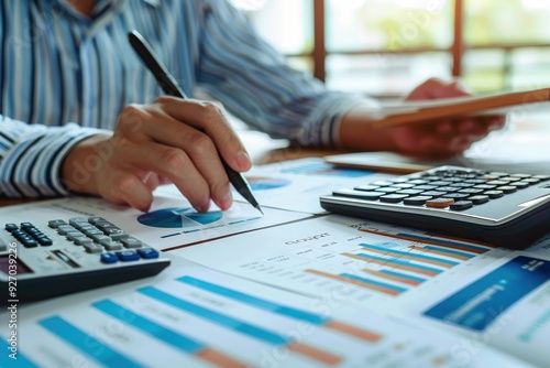 Close-Up of Hands Using Calculator and Analyzing Financial Documents