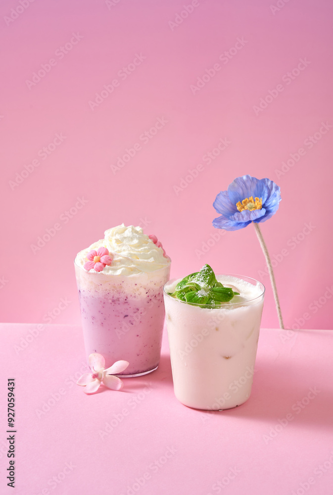 Ice cream milk purple sweet potato milk tea in a glass cup, pink gradient background Ice cream milk purple sweet potato milk tea in a glass cup, pink gradient background