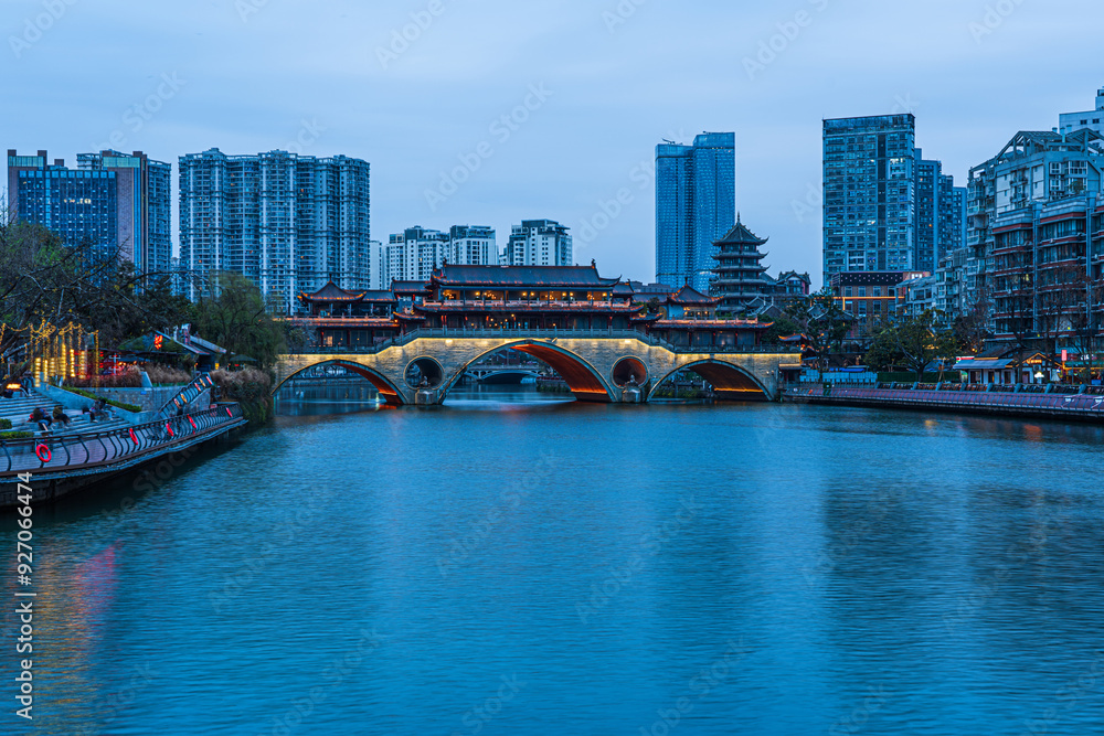 Fototapeta premium Famous landmark of Chengdu - Anshun bridge over Jin River illuminated at night, Chengdue, Sichuan , China