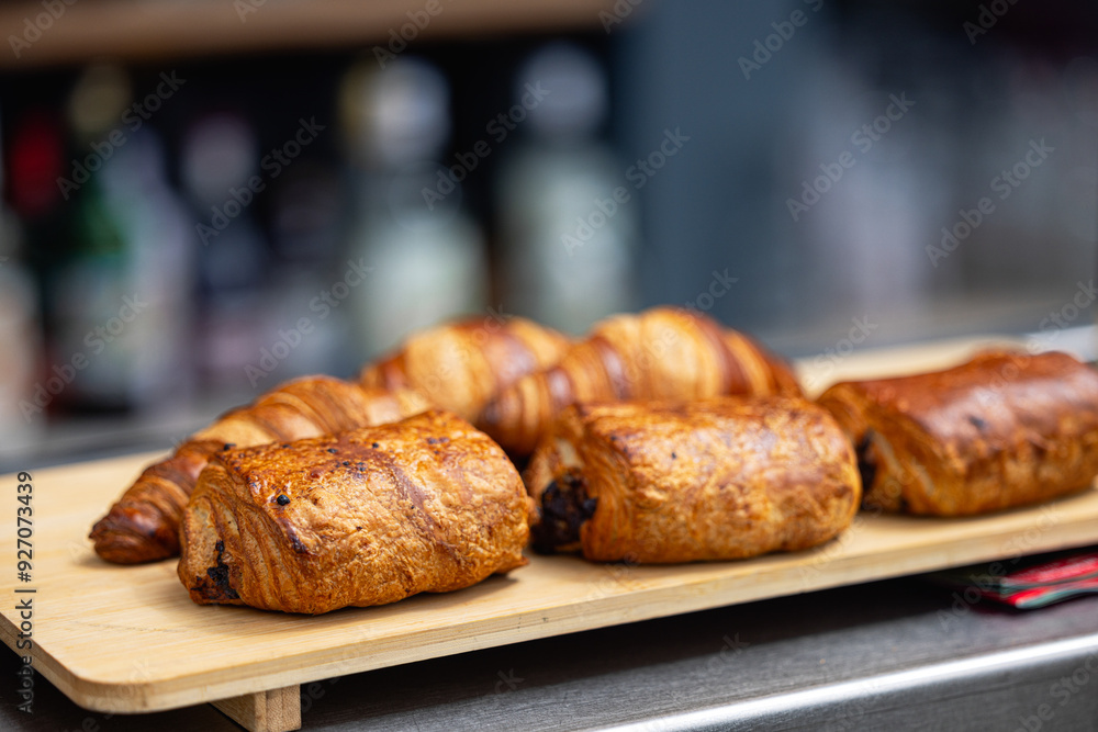 Fresh croissants on a cutting board close-up. French cuisine concept Fresh croissants on a cutting board close-up. French cuisine concept
