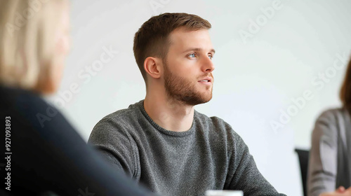 portrait of a man, team meeting in a modern office.