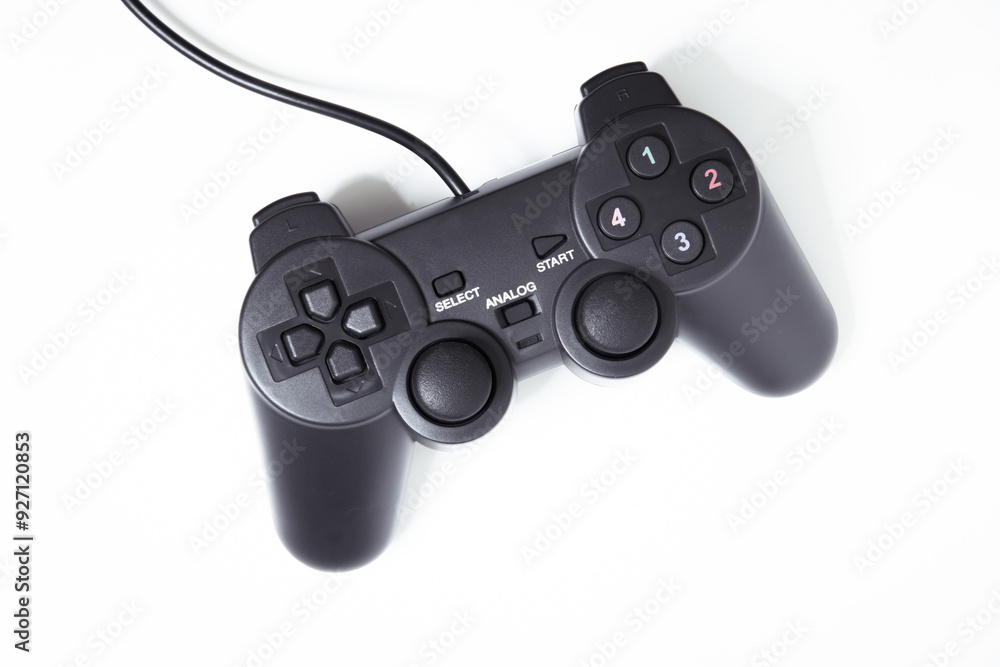 Black controller on white background, Video game device, Joystick on a white background. Black controller on white background, Video game device, Joystick on a white background.