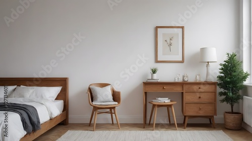 A bedroom interior design image with study table and arm chair, photo frame on the white wall interior image.