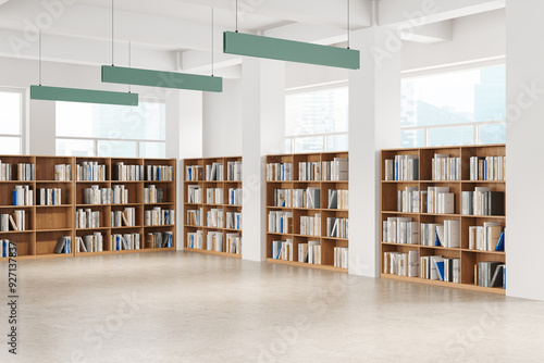 Photography Stylish library interior with wooden bookcase in row, panoramic window