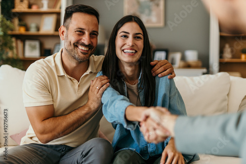 Obraz na płótnie Happy man and woman clients handshake close deal or close the agreement with a r