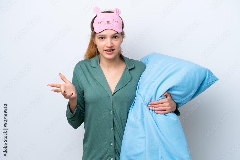 Teenager Russian girl isolated on white background in pajamas and with shocked facial expression Teenager Russian girl isolated on white background in pajamas and with shocked facial expression