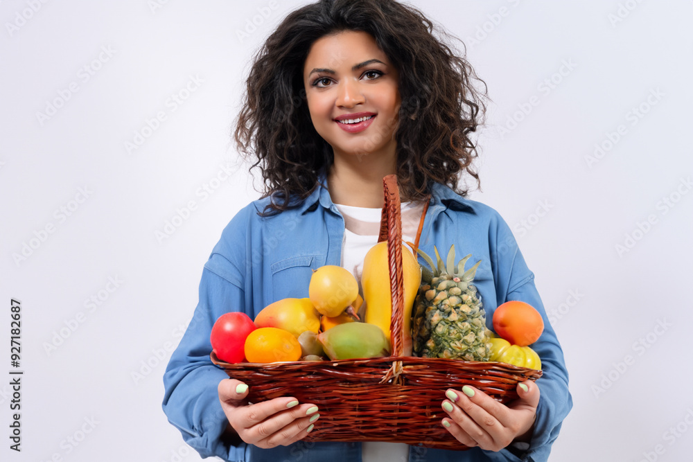 Girl is eating food in basket with fruit. grocery happy people concept. a girl in white with a basket of fruit on the . a girl is eating food in a basket of white fruits lifestyle. Girl is eating food in basket with fruit. grocery happy people concept. a girl in white with a basket of fruit on the . a girl is eating food in a basket of white fruits lifestyle.